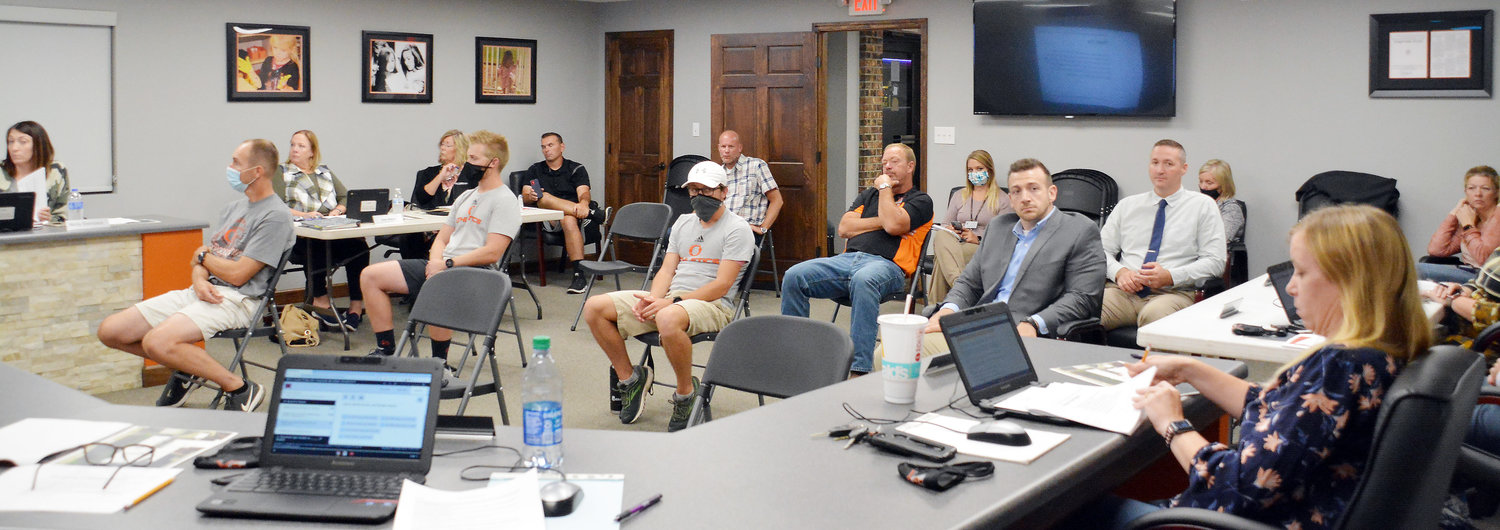 Gasconade County R-2 School District Board of Education members, administrators, and coaches covered numerous issues Monday related to the COVID-19 pandemic. Several coaches and both administrators at the middle school (in back) wore face masks.